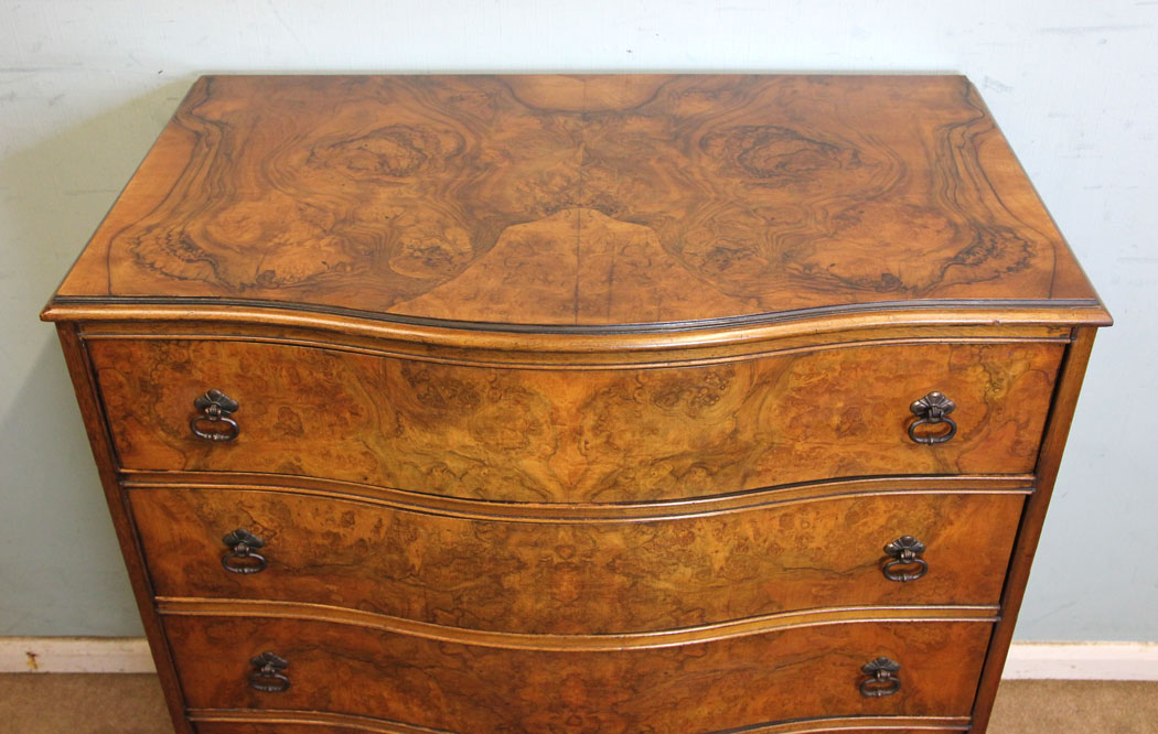 Serpentine front Burr Walnut Chest Drawers.
