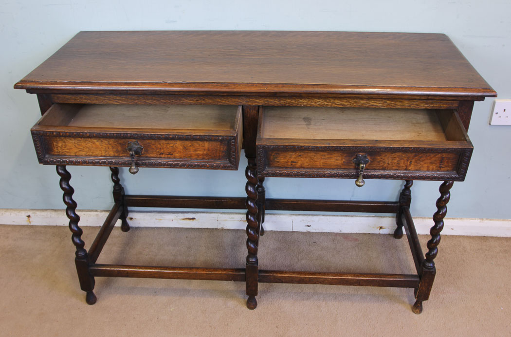 11376r10 Antique Oak Side Table, Antique Oak Barley Twist Two Drawer Side Table. This oak side table has a solid oak top with moulded edge under having two drawers
